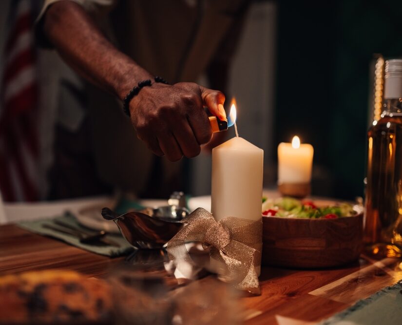 Chef,Lights,A,Candle,On,A,Table,Set,For,Dinner,